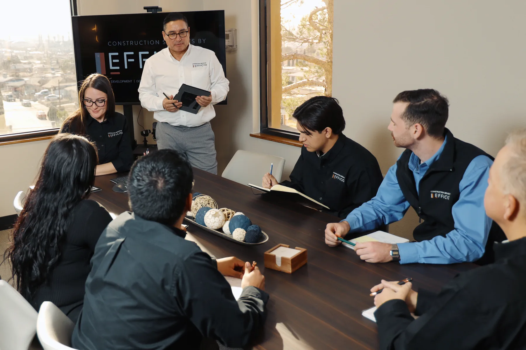 Efficio team gathered around a conference table
